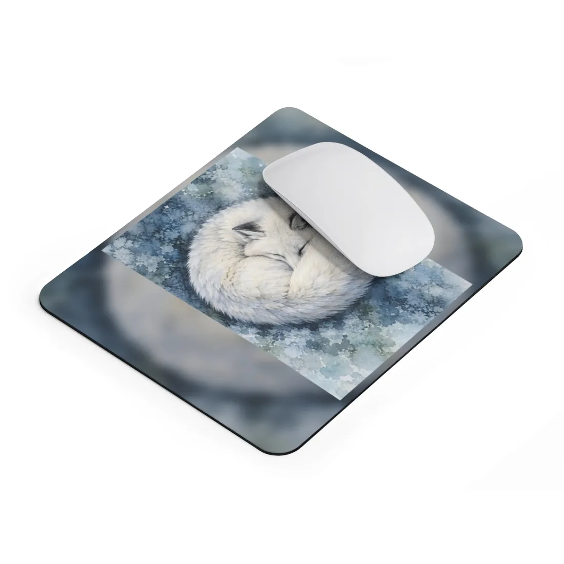 A white arctic fox sleeps curled in a circle on a blue, icy watercolor background, eyes closed – Mouse Pad, view 2