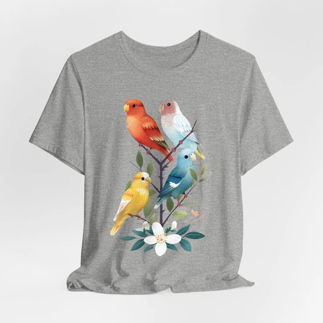Four colorful parakeets perch on a branch with leaves and white blossoms against a peach – T-Shirt, athletic heather