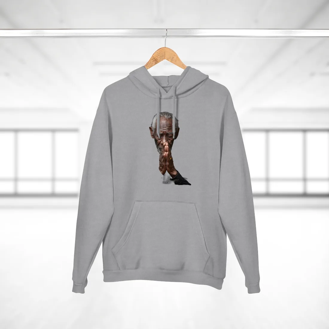 Elderly man with gray hair praying, eyes closed, hands clasped, in black shirt – Hoodie, heather grey
