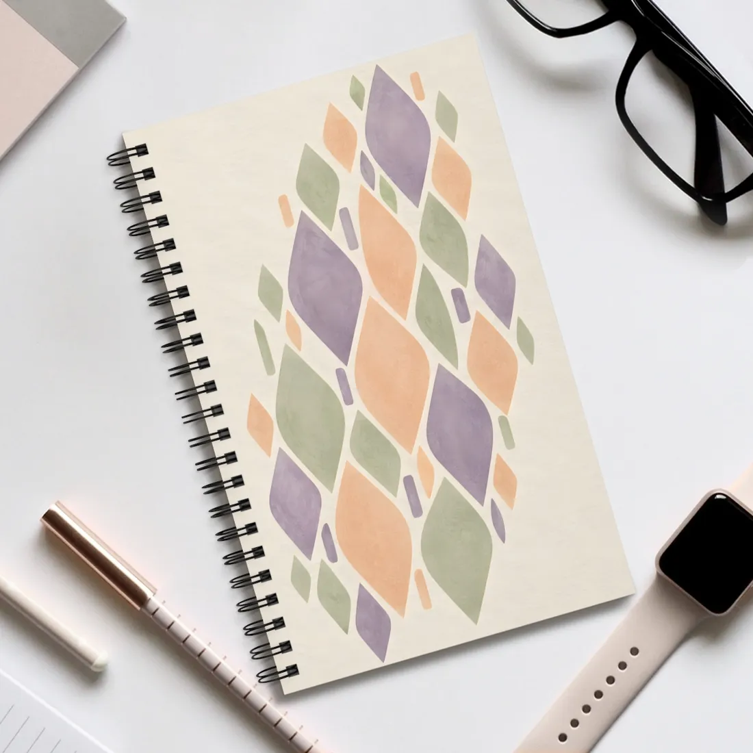 Pastel lavender, peach and sage leaf shapes arranged diagonally on a cream background – Spiral Notebook, view 2