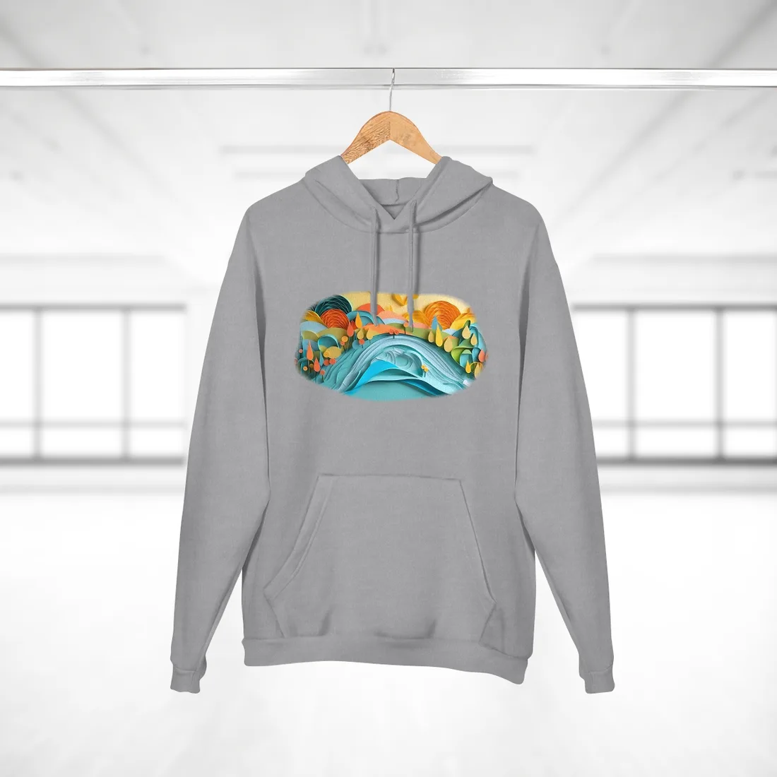 Layered paper-cut landscape with blue wave, orange and yellow hills, teardrop trees, and a warm yellow – Hoodie, heather grey