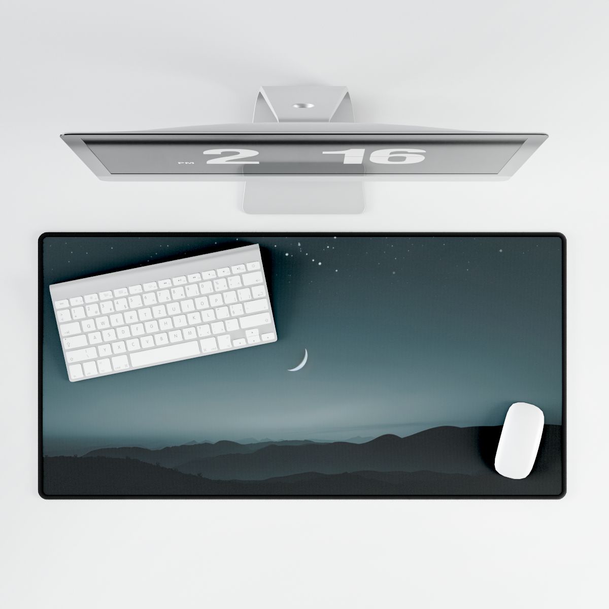 A thin crescent moon and stars above dark layered hills under a teal twilight sky – Desk Mat, room mockup, view 3