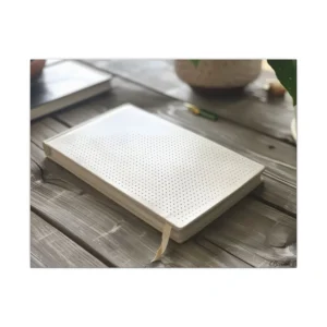 White Notebook on Wooden Table Canvas Print