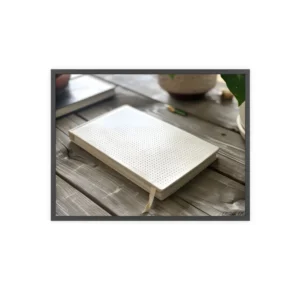 White Notebook on Wooden Table Framed Poster