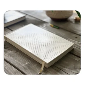 White Notebook on Wooden Table Mouse Pad