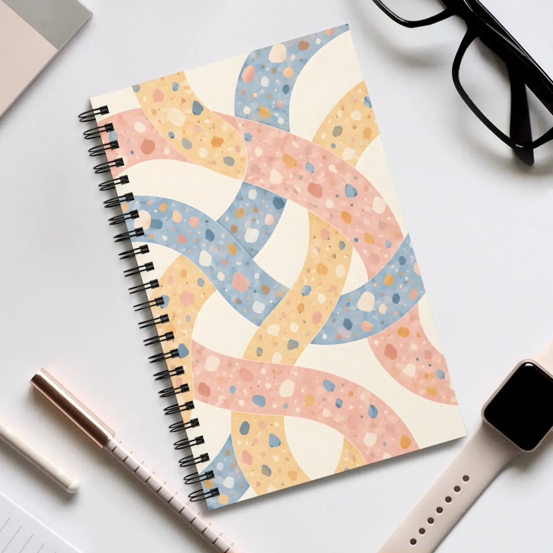 Interlaced pink, yellow and blue curved ribbons with speckled terrazzo dots on cream – Spiral Notebook, view 2