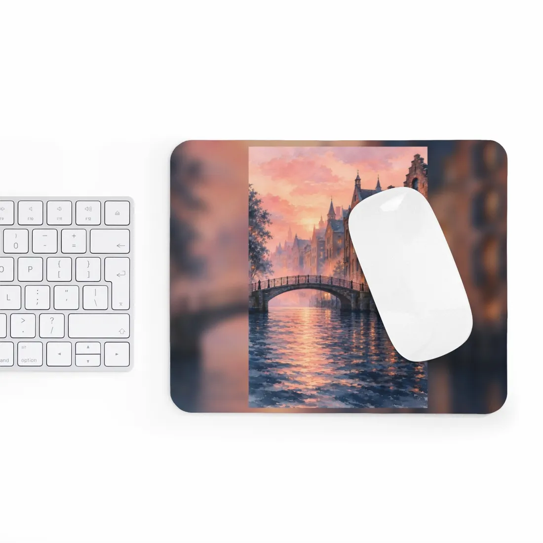 Arched footbridge over a rippling canal at sunset, with brick townhouses glowing warmly under a pink sky – Mouse Pad, view 3