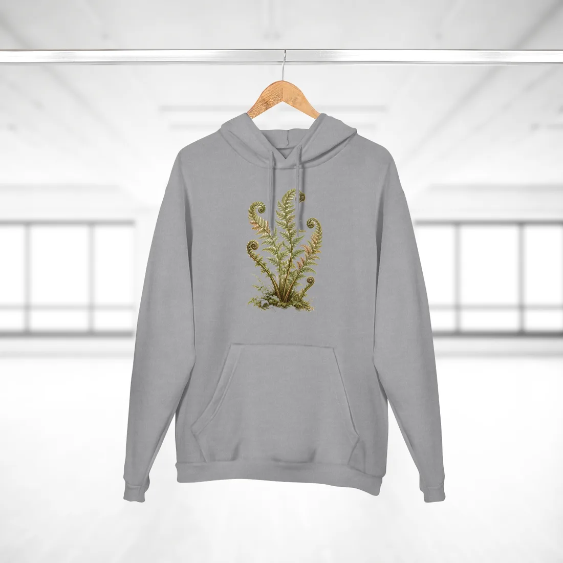 Botanical illustration of green fern fronds with spiraled tips rising from mossy ground on cream paper – Hoodie, view 2