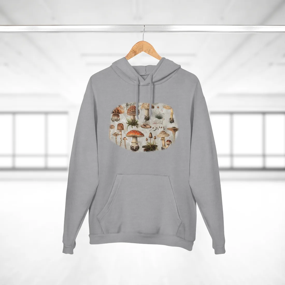 Vintage-style illustrations of many mushrooms with red, brown and cream caps on a – Hoodie, heather grey, room mockup