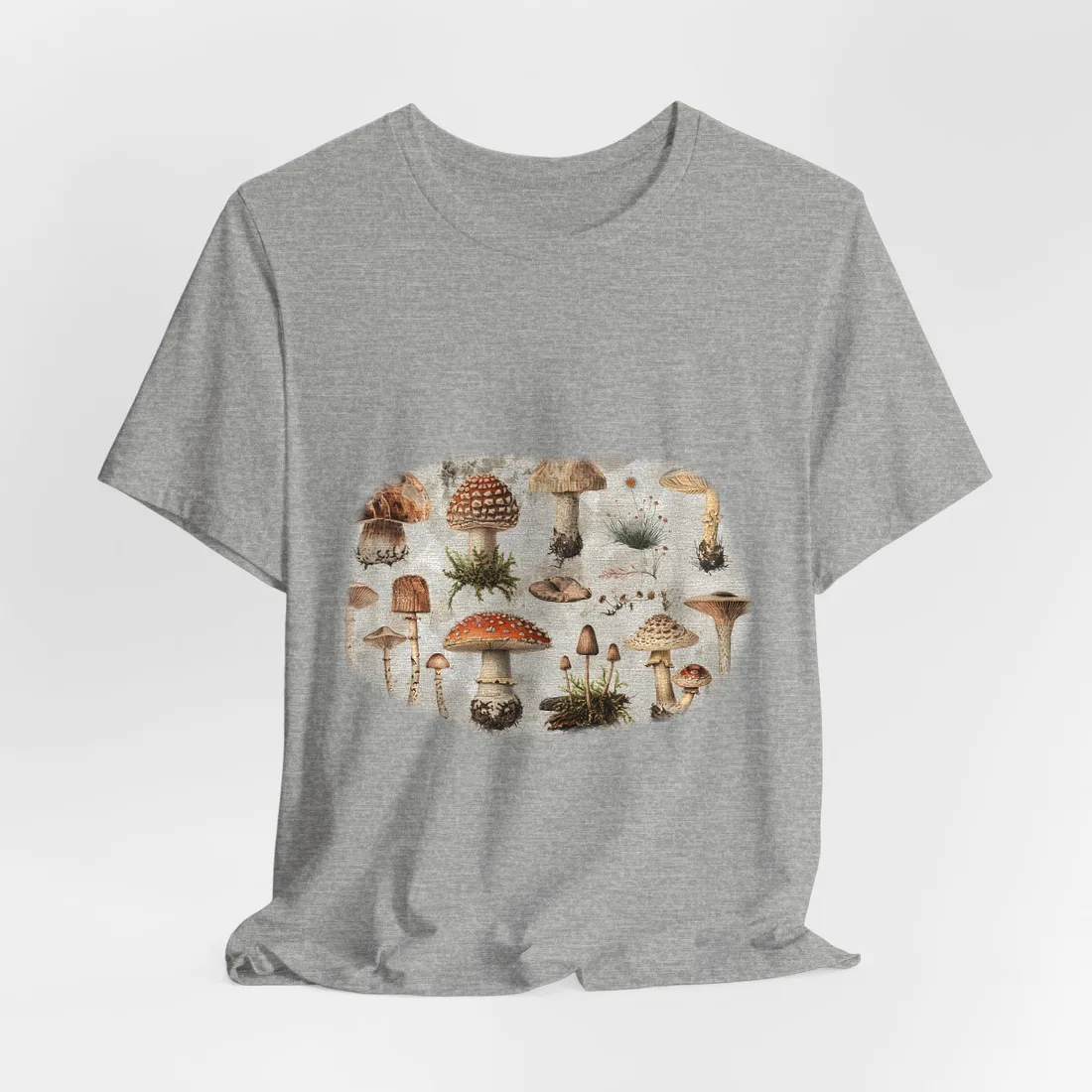 Vintage-style illustrations of many mushrooms with red, brown and cream caps on a – T-Shirt, athletic heather, room mockup
