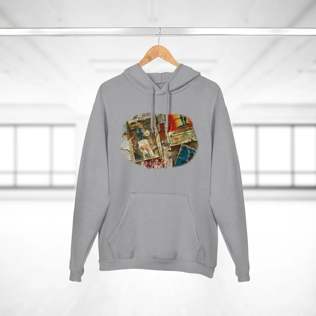 Layered vintage soccer posters on a cracked wall, with a green-jersey player kicking a ball at center – Hoodie, heather grey